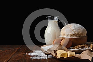 Raw eggs and other ingredients on table. Baking pie