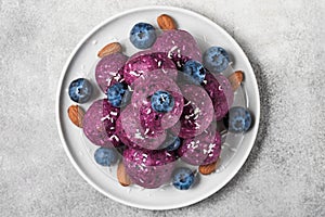 Raw energy balls with blueberries and acai powder. Healthy vegan food dessert. top view