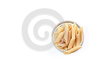 Raw feathers macaroni in bowl. Italian pasta close up, isolated on the white background