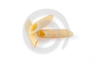 Raw feathers macaroni. Italian pasta close up on the white background