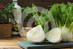 Raw fennel on kitchen table rustic photo