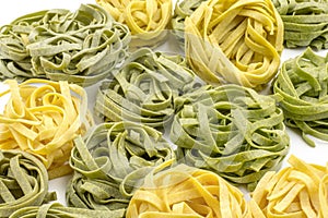 Raw Fettuccine paste isolated on white