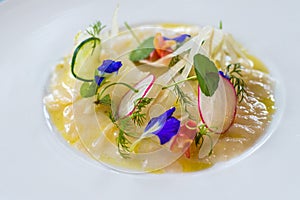Raw fish ceviche with edible flowers