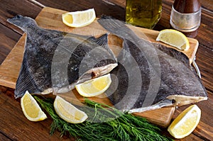 Raw fish flounder, flatfish on wood