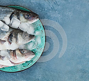 Raw Fish Italian delishes on blue marble background