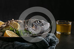 Raw fish presented in a metal dish