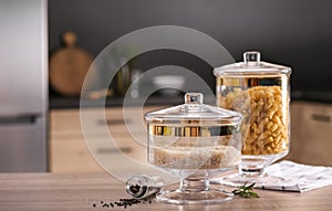 Raw foodstuff on wooden table in kitchen