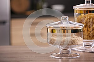 Raw foodstuff on wooden table in kitchen