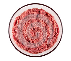 Raw forcemeat in bowl isolated on white. Top view