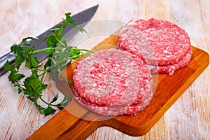 Raw formed hamburger patties