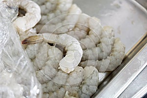 Raw freeze shrimp in metal plate prepared for cooking