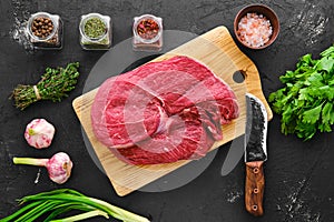 Raw fresh beef top round roast with spice and herbs