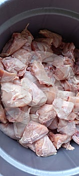 Raw fresh chicken breast pieces in the basket