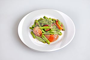 The raw of fresh ingredients for thai food for making long beans salad, tomato, lime - top view, closed up