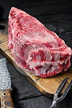 Raw fresh meat Ribeye steak entrecote of Black Angus Prime meat, on black wooden table background