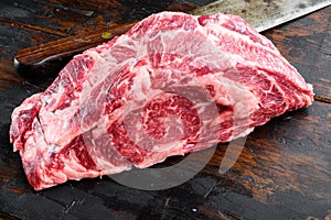 Raw fresh meat Ribeye steak entrecote of Black Angus Prime meat, on old dark  wooden table background