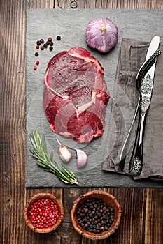 Raw fresh meat Ribeye steak entrecote and seasoning. top view