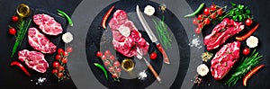 Raw fresh meat steak with cherry tomatoes, hot pepper, garlic, oil and herbs on dark stone, concrete background. Banner.