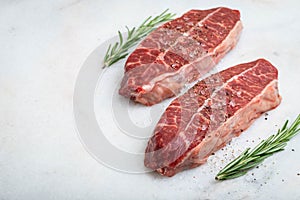 Raw fresh meat Top Blade steaks on light background. with copy space