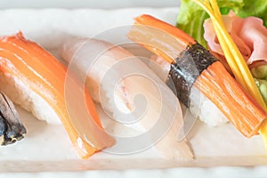 Raw and fresh nigiri sushi in white plate
