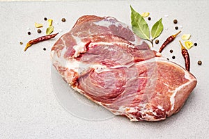 Raw fresh pork shoulder with spices