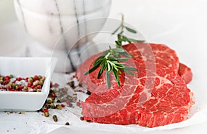 Raw fresh steaks from the marble beef, rosemary and spices