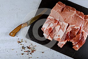 Raw fresh uncooked Pork Meat cutting chopping board for cutting raw of pork