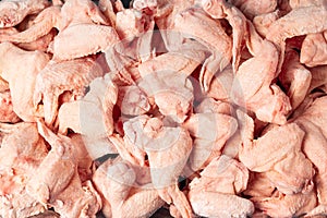 Raw frozen wings.Chicken wings background.Frozen raw chicken wings
