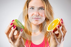 Raw fruits comparison, kiwi and orange