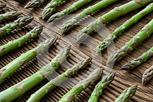 Raw garden asparagus stems. Fresh green spring vegetables