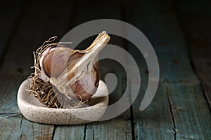 Raw garlic on wooden background, rustic style