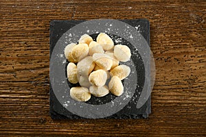 Raw gnocchi pasta on board