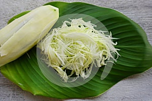 raw green papaya prepared on green leaf