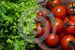 Raw green and red vegetables on rustic wood