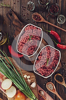 Raw ground beef with ingredients - In top view