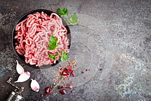 Raw ground beef meat with ingredients for cooking. Fresh minced meat