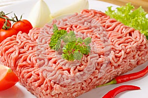 Raw ground pork and vegetables