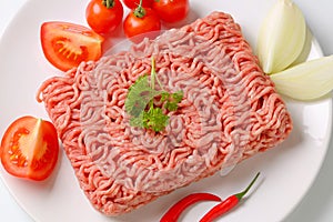 Raw ground pork and vegetables