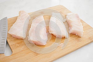 Raw Grouper Fillets on a Cutting Board photo