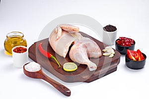 Raw half chicken with skin