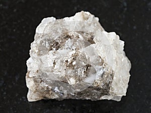 raw Halite (rock salt) stone on dark background
