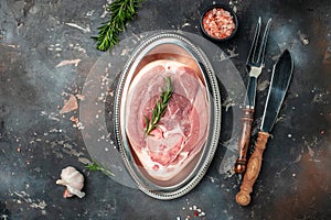 Raw ham cut, pork leg on a dark background, banner, menu, recipe place for text, top view
