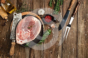 Raw ham cut, pork leg on a wooden background, banner, menu, recipe place for text, top view