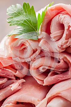 Raw Ham rolls on wooden table