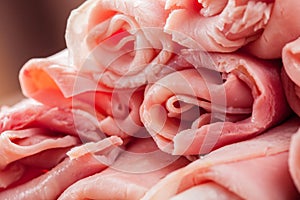 Raw Ham rolls on wooden table