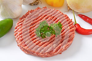 Raw hamburger patty