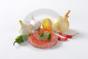 Raw hamburger patty