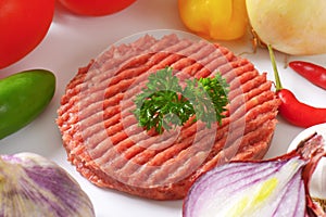 Raw hamburger patty