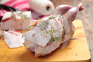 Raw Hazel Grouse on a chopping board
