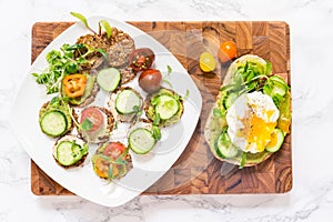 Raw healthy burger with avocado dressing, cucumbers, poached egg